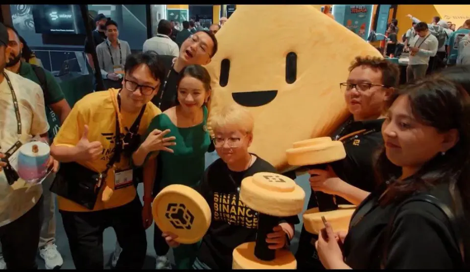 Bibi mascot with Binance crew at Blockchain Week